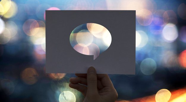 Global communications network perforated paper speech bubble